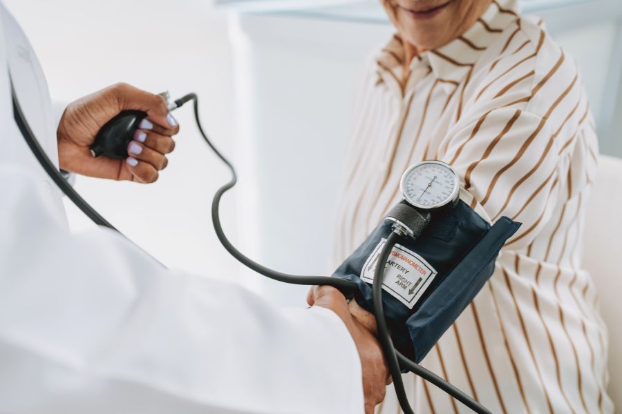 Healthcare professional measuring blood pressure